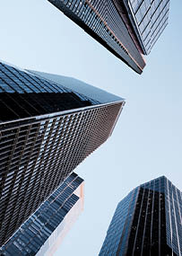 UK, London, low angle view of city financial district skyline illuminated at sunset